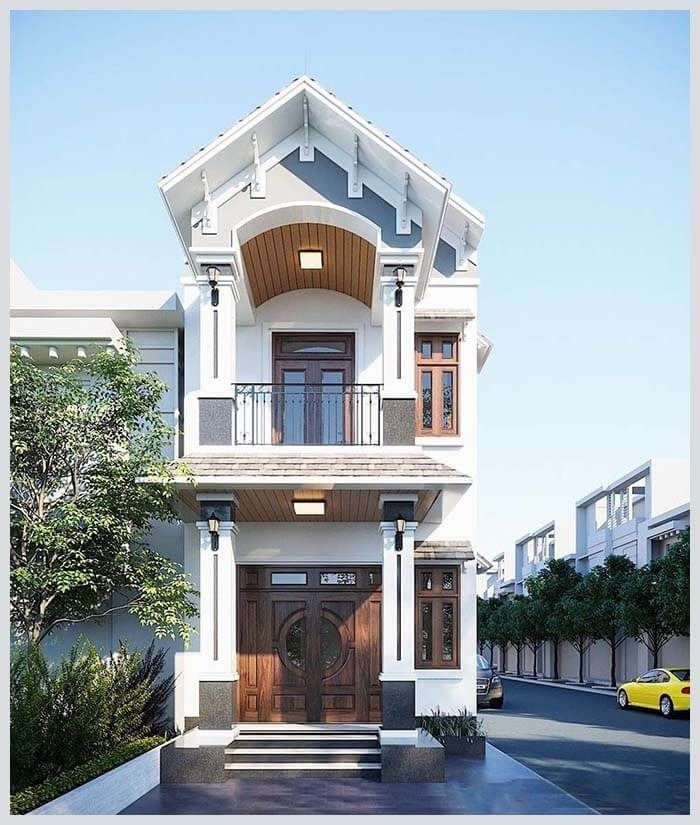 nhà mái thái 2 tầng cửa gỗ 